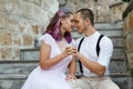 Couple in love is sitting on the stairs and embracing. Love and relationships between men and women Royalty Free Stock Photo