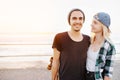 Couple, love and smile with date at beach in cold in summer or hot weather, together and support in London. Relationship Royalty Free Stock Photo