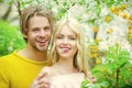 Couple in love in spring, easter. Love and romance, relationship, happy people. Sensual woman and man in cherry bloom. Royalty Free Stock Photo
