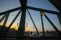 Couple in love is standing on the liberty bridge over the river Danube in Budapest. Sunrise in the big city. Dark silhouettes of Royalty Free Stock Photo