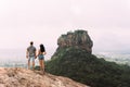 Guy and girl stand on the rock and admire the panoramic view Royalty Free Stock Photo