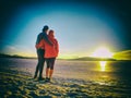 Couple in love stay at snow covered ice on the lake Royalty Free Stock Photo