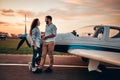 Couple in love staying near aircraft Royalty Free Stock Photo