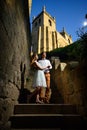 Couple in love strolling around an old castle Royalty Free Stock Photo