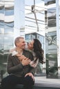 Couple in love. Stunning sensual outdoor portrait of woman hugging man on date. Happy couple dating on the street