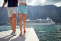 Couple in love on  summer vacations.Man and woman  walks dock together by the lake Royalty Free Stock Photo