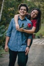 Couple in love at a sunset in the forest.