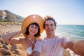 couple in love takes a selfie on the phone. selfie on the beach on a sunny summer day