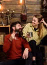 Couple in love talking in romantic atmosphere, wooden background. Couple spend cozy pleasant evening with hot drinks