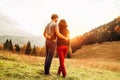 Couple in love tender huge eeach other on the sunset meadow