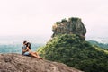 A couple in love on a rock admires the beautiful views Royalty Free Stock Photo