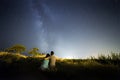 Couple in love under stars of Milky Way Galaxy Royalty Free Stock Photo