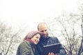 Couple in love using tablet connecting web wireless wifi