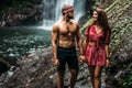 A couple in love on vacation in Asia. The couple is vacationing in the tropics. Beautiful couple at the waterfall. Royalty Free Stock Photo