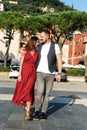 Love story. A guy and pretty girl in red dress Royalty Free Stock Photo