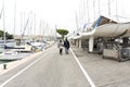 Couple in love walking along the promenade. Happy man and woman walking along the promenade along the sea - Immagine