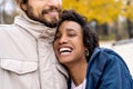 Couple in love are walking in the autumn park. Afroamerican girl with a European Royalty Free Stock Photo