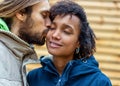 Couple in love are walking in the autumn park. Afroamerican girl with a European Royalty Free Stock Photo