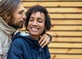 Couple in love are walking in the autumn park. Afroamerican girl with a European Royalty Free Stock Photo