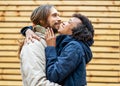 Couple in love are walking in the autumn park. Afroamerican girl with a European Royalty Free Stock Photo