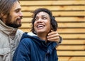 Couple in love are walking in the autumn park. Afroamerican girl with a European Royalty Free Stock Photo