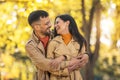 Couple in love walking on autumn park, enjoying a beautiful autumn day Royalty Free Stock Photo