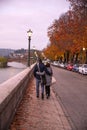 Couple in love walking in the autumn streets of Verona. Stylish young couple walking on european autumn streets , have fun and