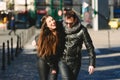 Couple in love walking casually embraced and laughing with loud laughter Royalty Free Stock Photo