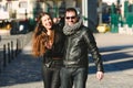 Couple in love walking casually embraced and laughing with loud laughter Royalty Free Stock Photo