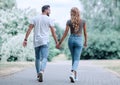 Couple in love walking in park holding hands Royalty Free Stock Photo