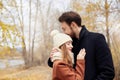 Couple in love walking in the Park, Valentine`s day. A man and a woman embrace and kiss, a couple in love, tender feelings Royalty Free Stock Photo