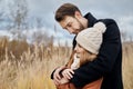 Couple in love walking in the Park, Valentines day. A man and a woman embrace and kiss, a couple in love, tender feelings and love Royalty Free Stock Photo