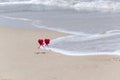 Couple in love walking on sea beach washed by wave. Two hearts on sea coast. valentine card, summer holidays background Royalty Free Stock Photo