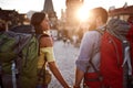 Couple in love walking in the streets of Prague at sunset.Travel, tourism and people concept