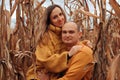 A couple in love walks in the middle of a dry corn field Royalty Free Stock Photo