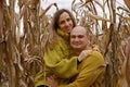 A couple in love walks in the middle of a dry corn field Royalty Free Stock Photo