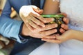 Couple in love warming his hands on a cup of hot tea. Royalty Free Stock Photo