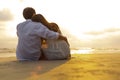 Couple in love watching sunset together on the beach travel summer holidays. People romance concept Royalty Free Stock Photo