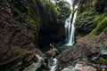 A couple in love on a waterfall. Honeymoon trip. Happy couple on the island of Bali. Beautiful couple travels the world. Travel Royalty Free Stock Photo