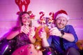 Couple having fun celebrating New Year at house party Royalty Free Stock Photo