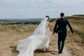 Couple love wedding together outside field path