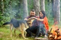 Couple in love, young happy family spend leisure with dog.