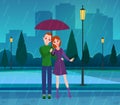 Couple in love. Young people in love under umbrella in park, rainy weather, husband and wife hugging in street on Royalty Free Stock Photo