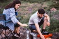 Couple lover cooking food for dinner outside tent together,Enjoying camping concept Royalty Free Stock Photo