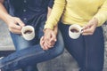 Couple lover having date and drinking a cup of coffee together. happy relation on cafe. coffee lover concept. Close up woman hands Royalty Free Stock Photo