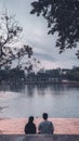 A couple of lovers are enjoying the afternoon atmosphere at one of the lake spots at the Senayan Park Mall