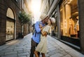 Couple of lovers kissing on city street - Two tourists enjoying romantic vacation together Royalty Free Stock Photo