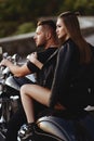 Couple of lovers kissing and hugging on motorbike Royalty Free Stock Photo