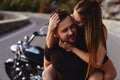 Couple of lovers kissing and hugging on motorbike Royalty Free Stock Photo