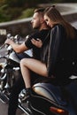 Couple of lovers kissing and hugging on motorbike Royalty Free Stock Photo